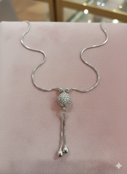Silver Tone Crystal Sphere Pendant Necklace with Tassel Drop Detail