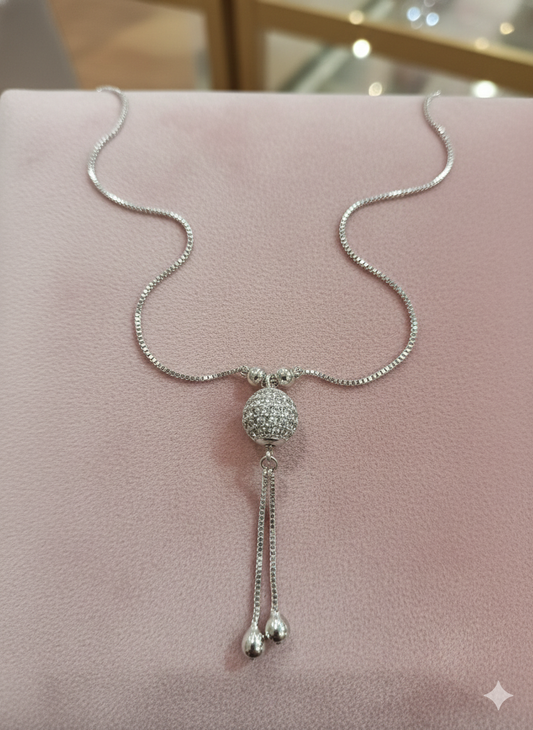 Silver Tone Crystal Sphere Pendant Necklace with Tassel Drop Detail