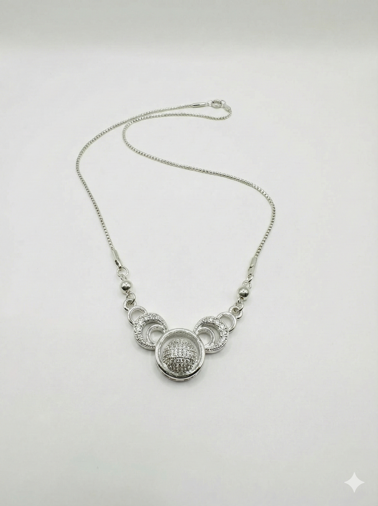 Elegant Triple Ring Silver Necklace with Shimmering Crystal Ball Pendant