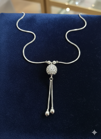 Silver Tone Crystal Sphere Pendant Necklace with Tassel Drop Detail